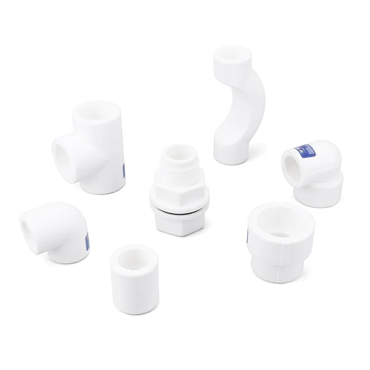 Group of white PPR fittings arranged together, showing socket-fusion ends across several diameters