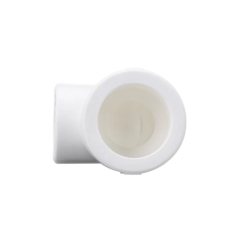White PPR socket coupler photographed on a plain background, the kind of moulded fitting examined at the moulding station of an audit