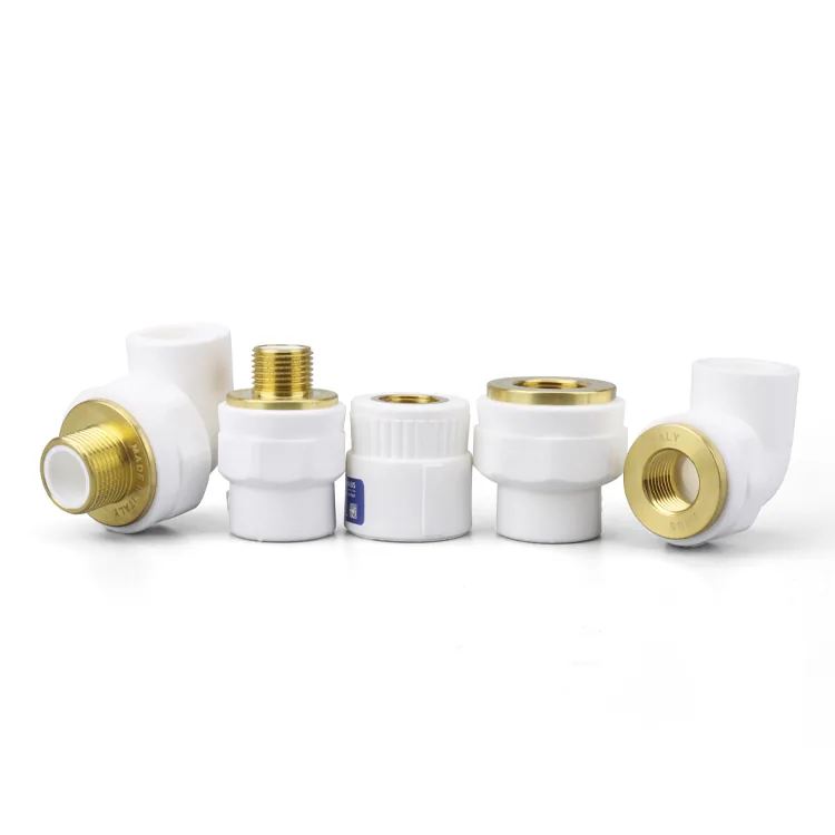 Group of white PPR fittings with brass inserts arranged on a plain background — elbows, sockets and threaded transition pieces