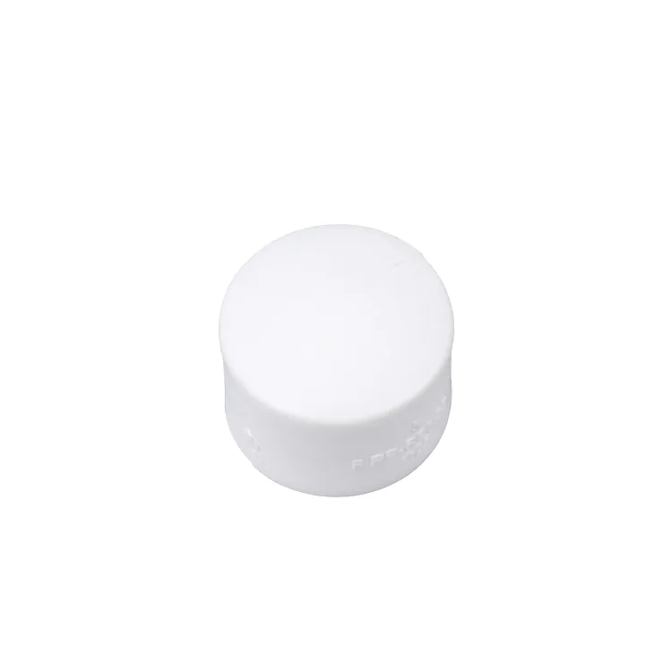 White PPR end cap photographed on a plain background, used to close cut pipe ends against dust during storage and site work